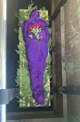 shrouded body in grave